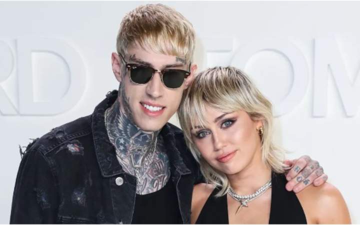 Trace Dempsey with Miley Cyrus after his body transformation 